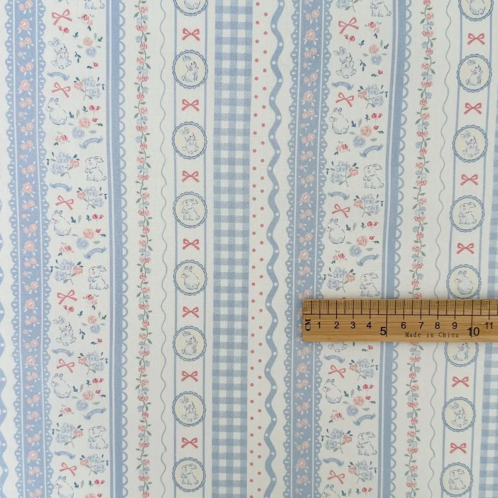 ผ้าคอตตอน 100% cotton poplin  ตัดขายเป็นเมตร หน้ากว้าง 145 เซนติเมตร ลาย Rabbit bow flower ลายRabbit bow flower