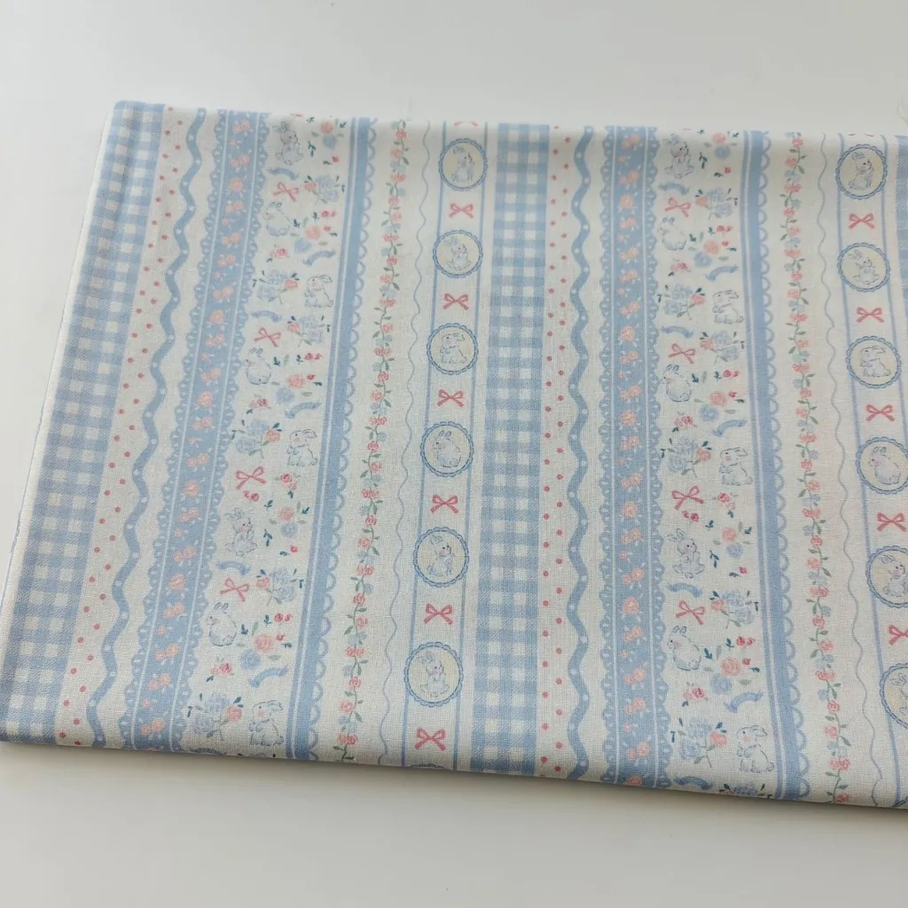 ผ้าคอตตอน 100% cotton poplin  ตัดขายเป็นเมตร หน้ากว้าง 145 เซนติเมตร ลาย Rabbit bow flower